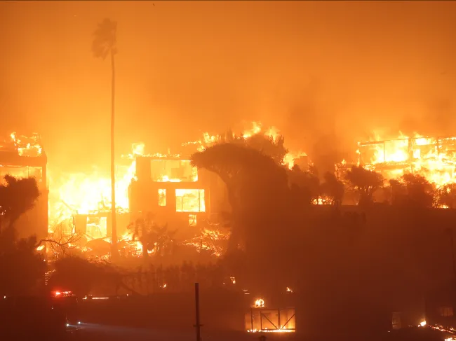 Buildings burn in the Palisades Fire of January, 2025